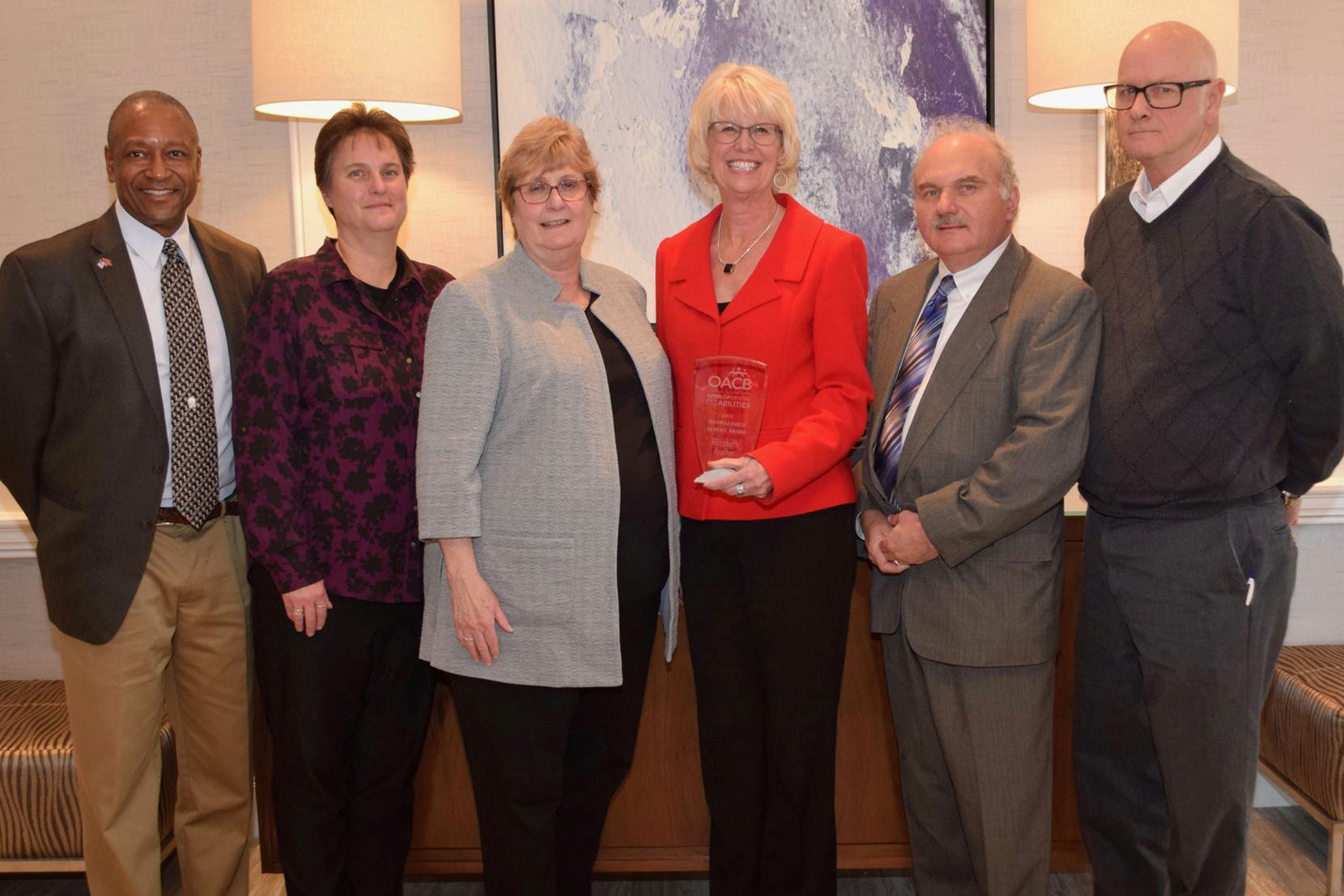 Prather honored with Distinguished Service Award from OACB